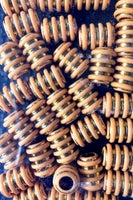 Decorative gold barrel hair beads