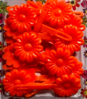 orange flower barrettes