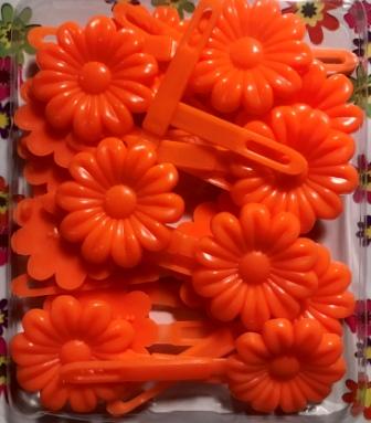 orange flower barrettes