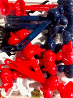 red white blue and black bow barrettes