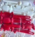 Red, white, and clear candy barrettes