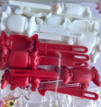 Red, white, and clear candy barrettes