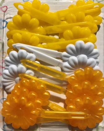 Yellow and white flower barrettes
